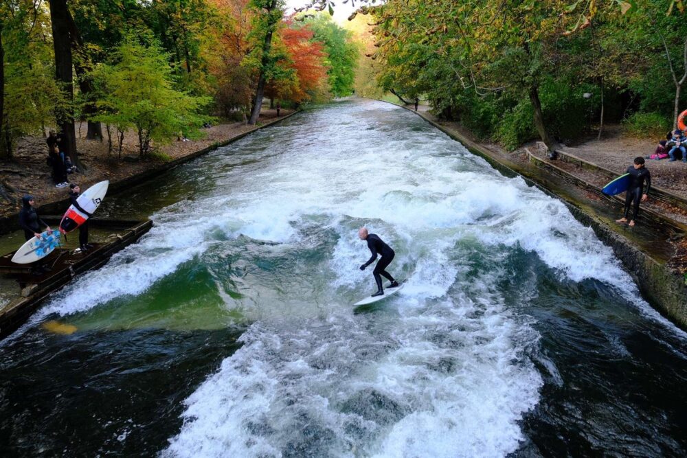 Explore the best things to do in Munich: Surf on Eisbach